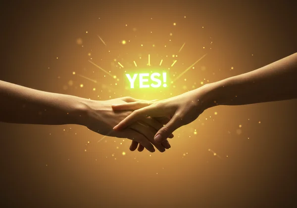 Two hands giving a clear, enthusiastic 'yes' gesture.